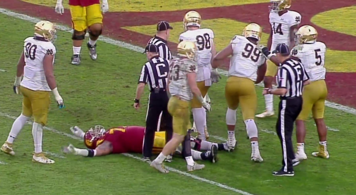 Charlie Strong Officially Fired; Notre Dame DL kicks USC RB in Head